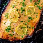 Cooked salmon on a baking tray.